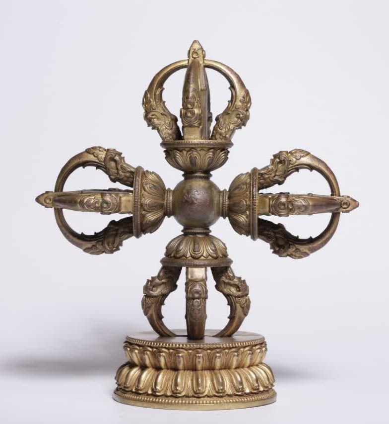 A Qing Dynasty copper gilt cross vajra (1 of 7)