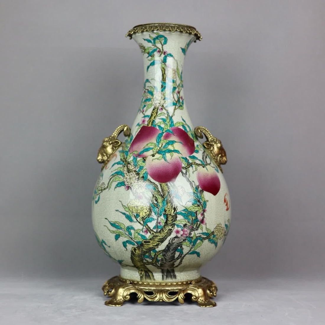 A pastel nine-peach picture inlaid with a bronze sheep's head amphora jade pot spring vase: Pastel nine peaches inlaid with copper sheep's head amphorae jade pot spring vase SIZE: H: 48cm MouthD: 16cm D: 24cm Bottom diameter 20cm (The Dimensions Of All Batches Are Manually Measured.If You Ne