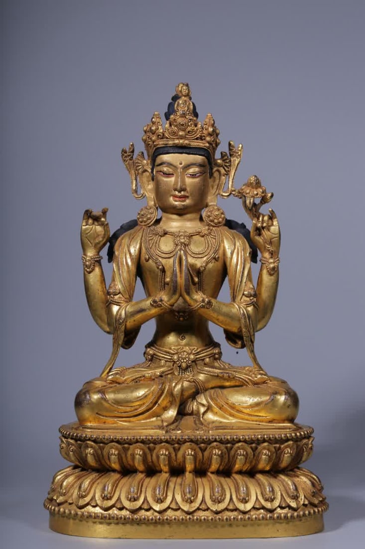 A seated statue of Guanyin with four arms in copper gilt in the Qing Dynasty: Qing Dynasty copper gilt four-armed Guanyin seated statue SIZE: H:25.5cm L:16cm W:11cm W:2453g (The Dimensions Of All Batches Are Manually Measured.If You Need More Detailed Information, Please Contac