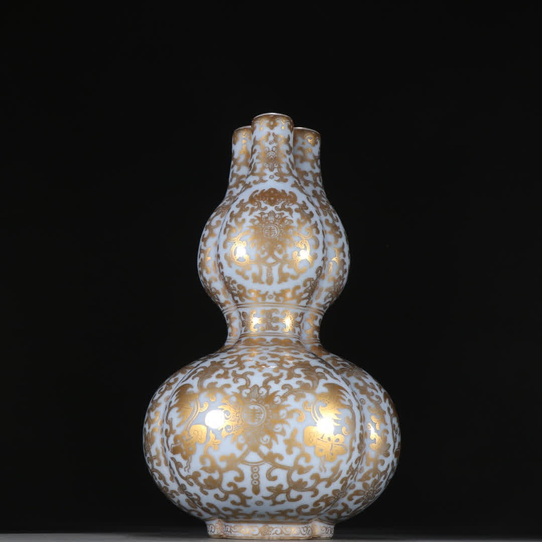 A Qing Dynasty bean celadon glazed gold-painted "Fushou Lianlian" three-barreled gourd bottle: Qing Dynasty bean celadon gold-painted "Fushou Lianlian" three-barrel gourd bottle SIZE: H:21.5cm W:12.4cm (The Dimensions Of All Batches Are Manually Measured.If You Need More Detailed Information, P