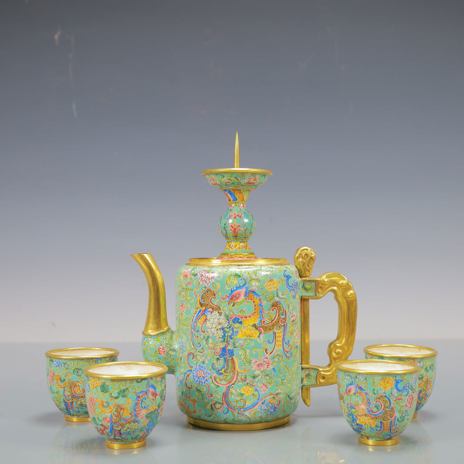 A Exquisite A Set of Coppery Enamel Lotus Pattern Phoenix Pattern Ewer Cup: A Exquisite A Set of Coppery Enamel Lotus Pattern Phoenix Pattern Ewer Cup Qing Dynasty, China Kangxi Four-character Mark Teapot Size:17cmx9cmx23cm Cup Size:5.5cmx5cm Weight:1100g (The Dimensions Of A