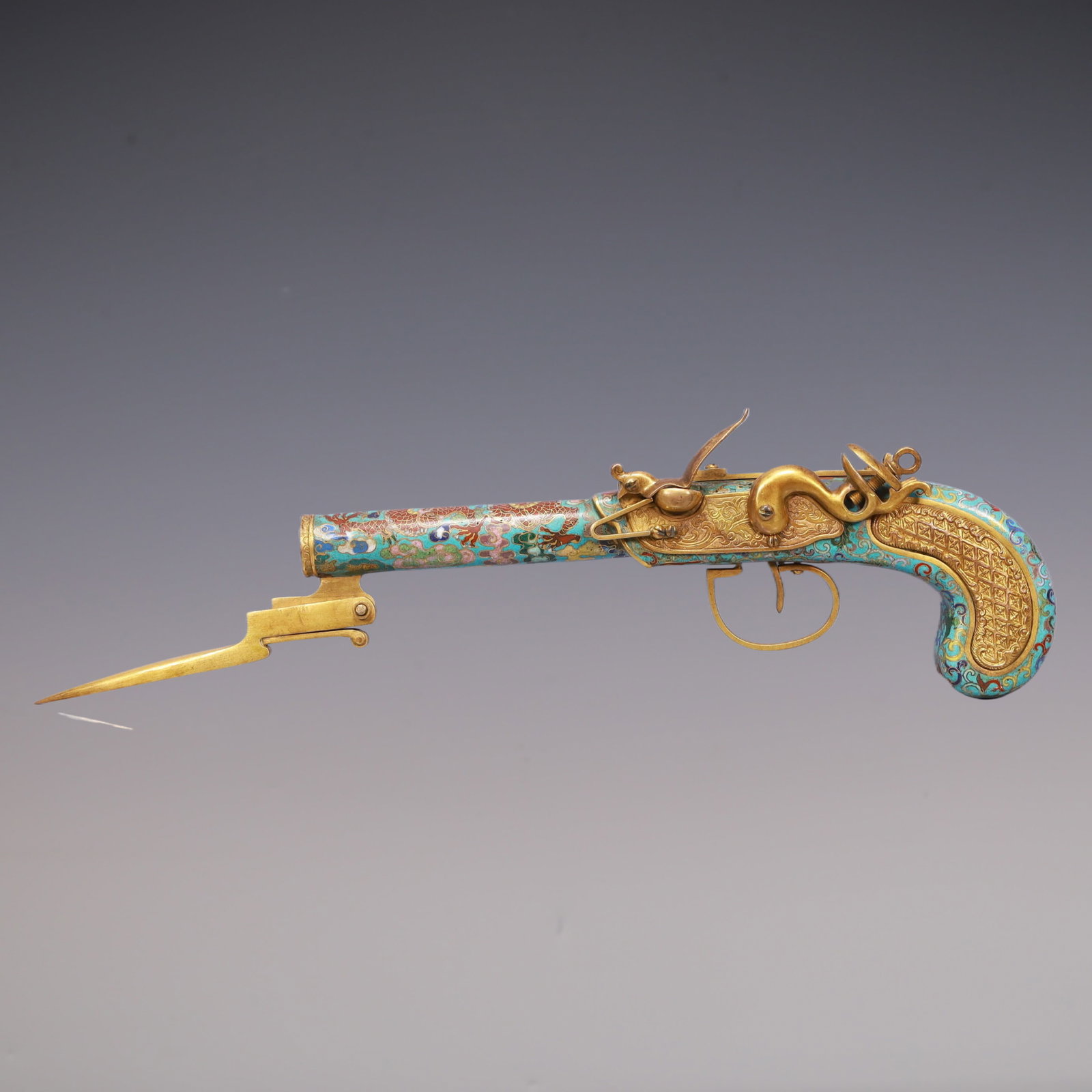 A Exquisite Cloisonne Dragon Pattern Pistol: A Exquisite Cloisonne Dragon Pattern Pistol Qing Dynasty, China Qianlong Four-character Mark Size:38cmx8cmx3cm Weight:650g (The Dimensions Of All Batches Are Manually Measured.If You Need More Detaile