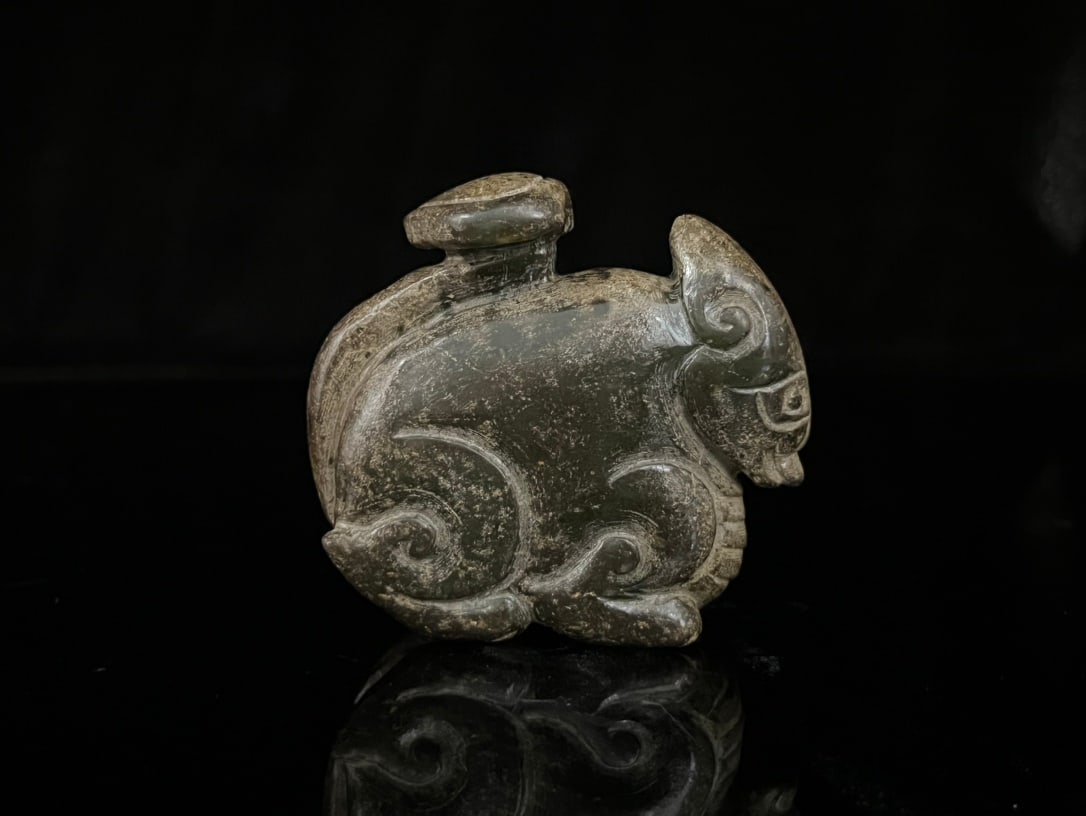 An Exquisite White Jade Auspicious Beast Ornament (1 of 9)