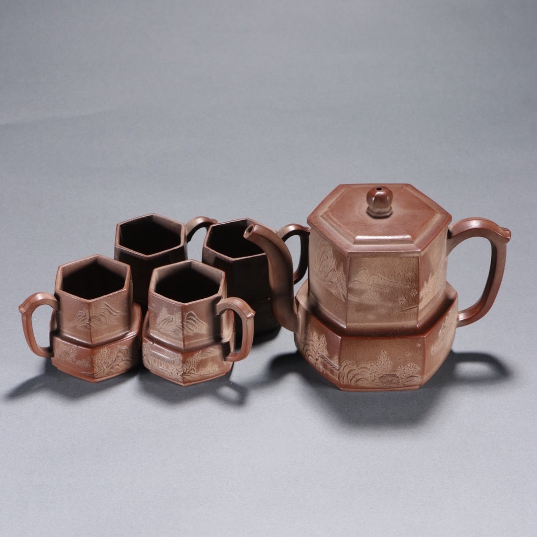 A set of purple sand pile carved landscape map teapots of Zhou Jishan in the Ming Dynasty (1 of 9)