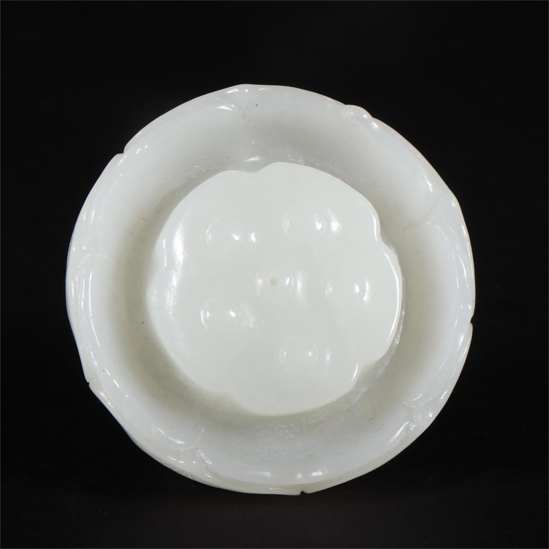 A Qing Dynasty Hetian jade lotus-shaped incense insert (1 of 9)
