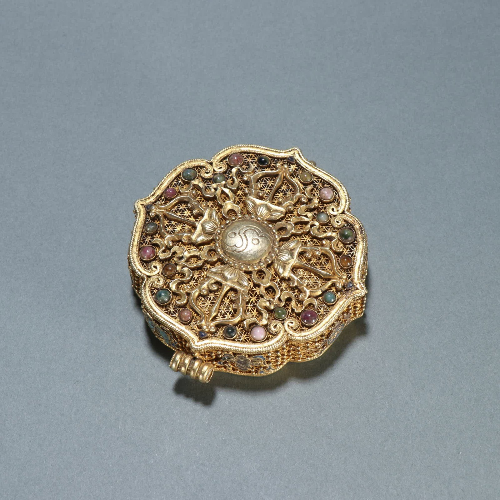 A Qing Dynasty silver-gilt filigree inlaid tourmaline lid box (1 of 9)