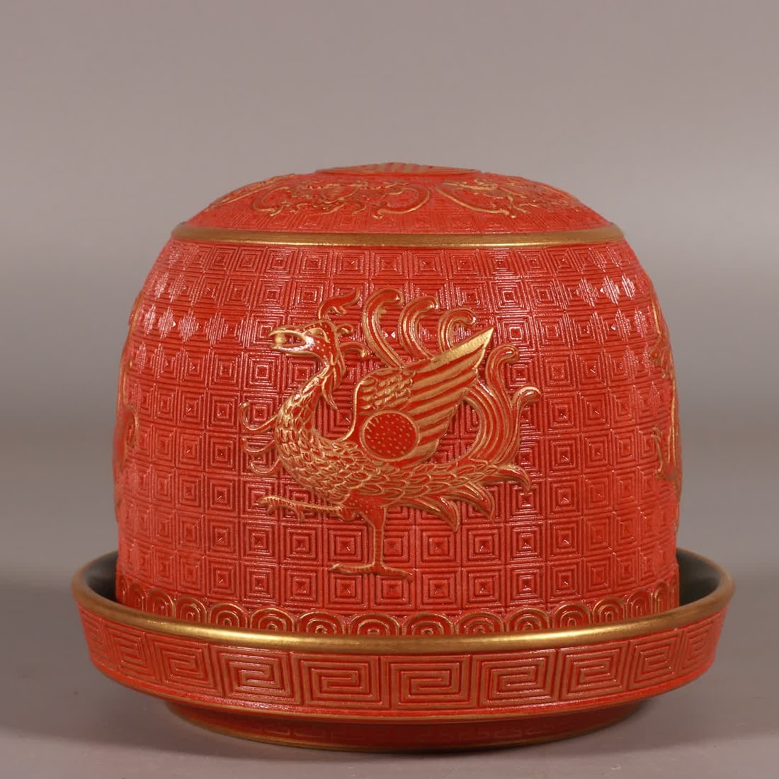 A Qing Qianlong alum red gold-painted carved four divine beast dice cup (1 of 9)