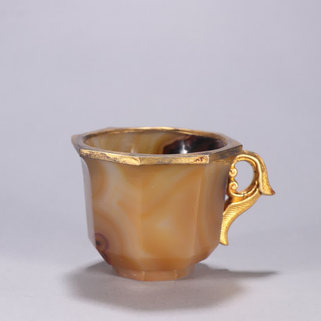 A piece of Liao gold agate wrapped gold cup: Liao Jin Agate Gold Cup SIZE: H:5.3cm W:8.1cm W:138.5g (The Dimensions Of All Batches Are Manually Measured.If You Need More Detailed Information, Please Contact Our Customer Service Before Bidding.)