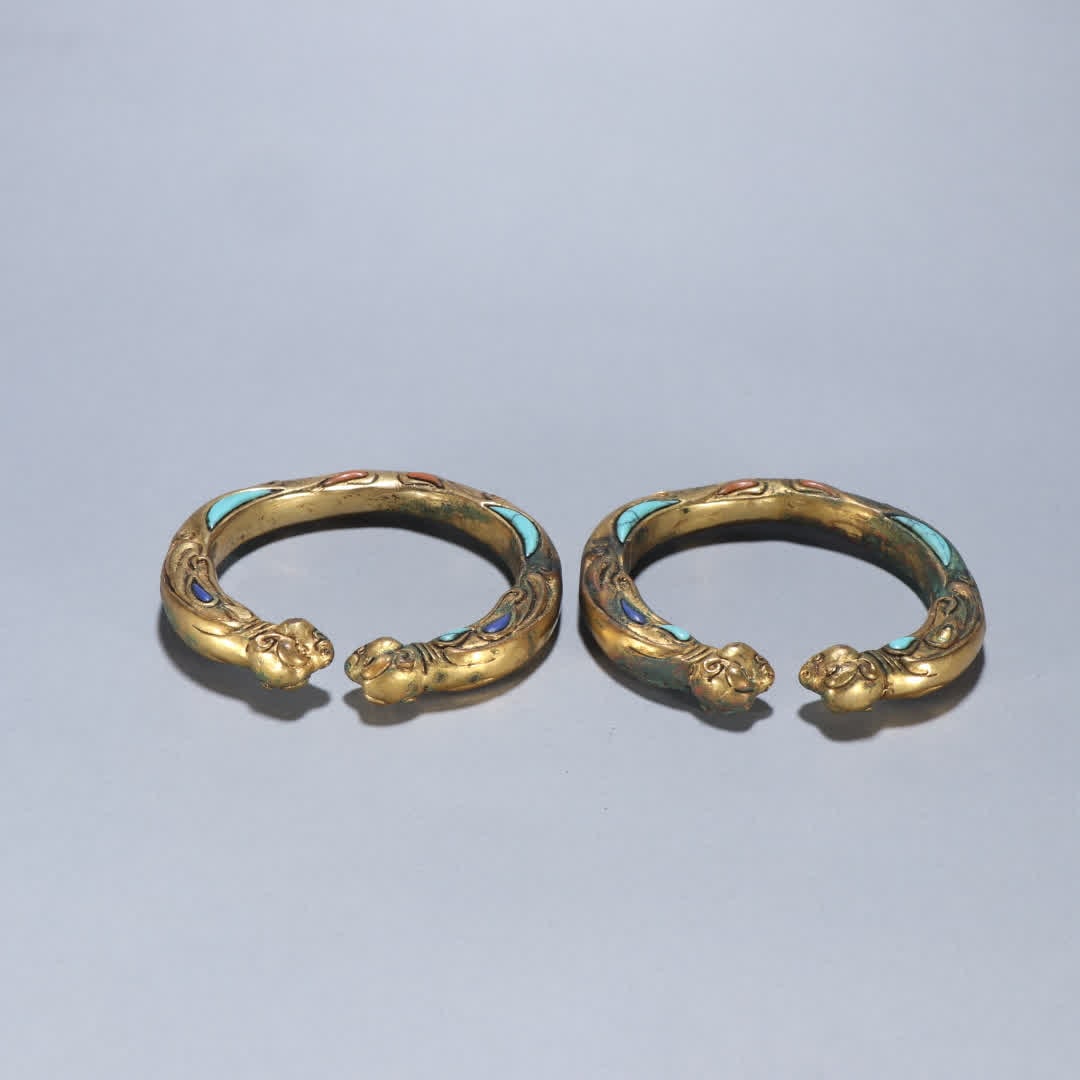 A pair of copper-gilt inlaid bracelets (1 of 9)