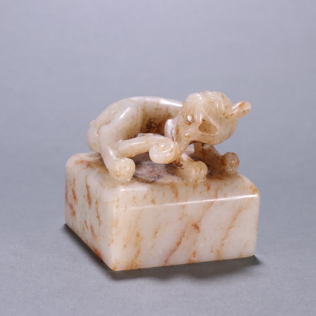 A Hetian jade auspicious beast button seal (1 of 9)
