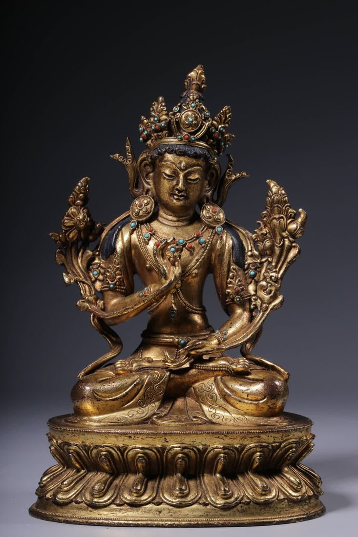 A seated statue of Guanyin in the Qing Dynasty with copper gilt inlaid treasures (1 of 10)