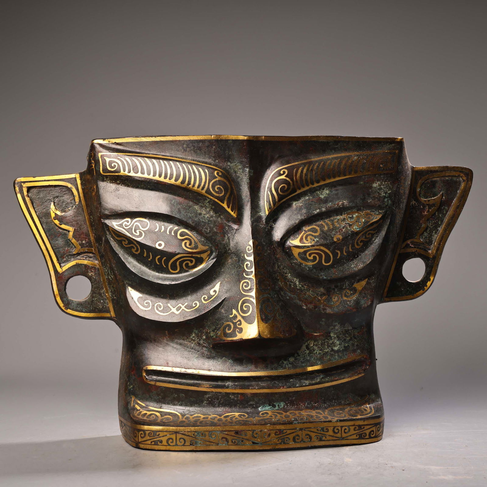 A bronze gold mask (1 of 9)
