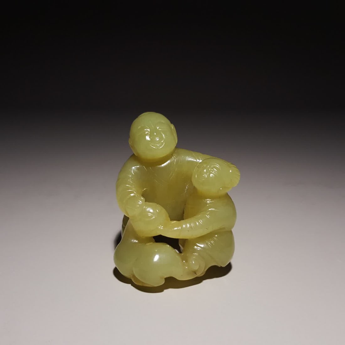 A Qing Dynasty Hetian jade topaz boy: Qing Dynasty Hetian jade topaz boy SIZE: 4.6x3.9x3.5cm W:54g (The Dimensions Of All Batches Are Manually Measured.If You Need More Detailed Information, Please Contact Our Customer Service Before Bidd