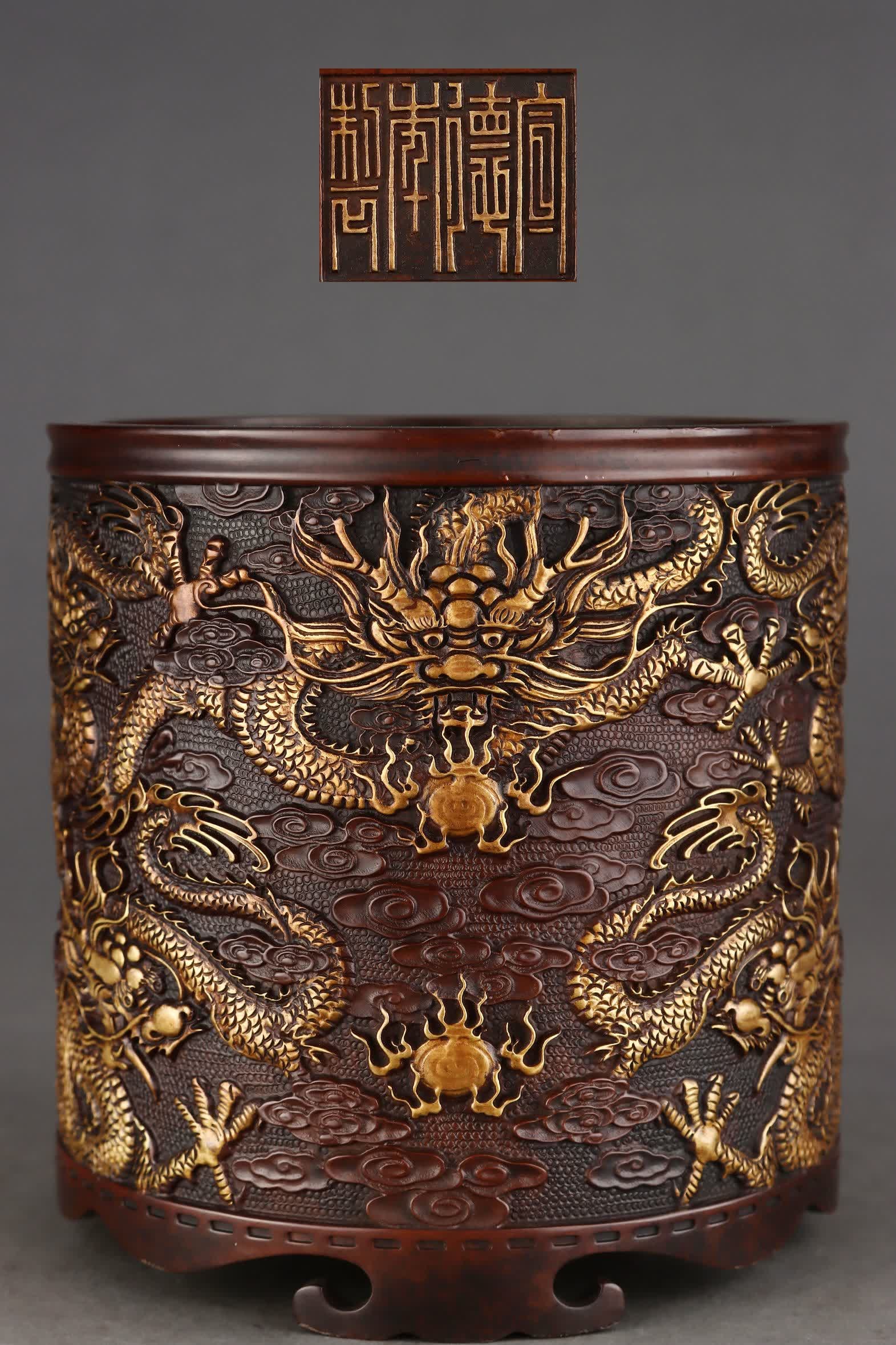 A Ming Dynasty precision-cast copper tire gilt nine dragon beaded pen holder: Ming Dynasty Fine cast copper tire gilt Kowloon play bead pattern pen holder (style) Xuande year system (detailed) This pen holder is straight and shaped, the shape is regular, the casting is deep, th