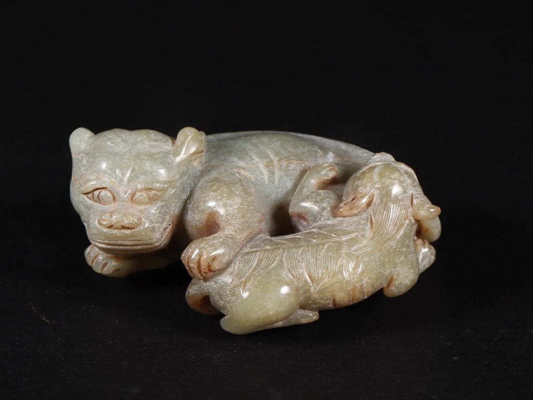 A Ming Dynasty Hetian jade lion ornament (1 of 9)
