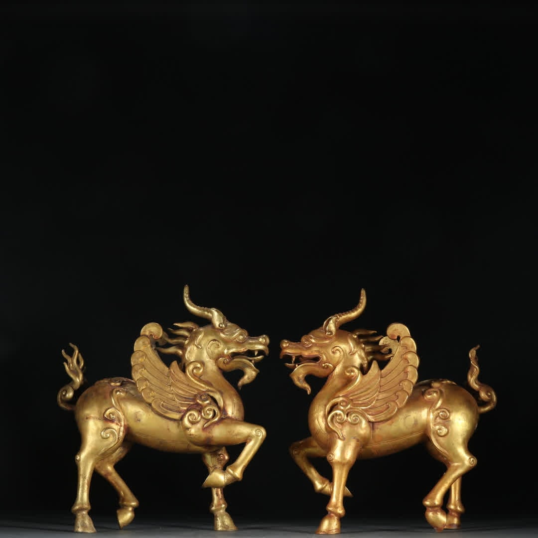 A pair of Liao copper gilt unicorn ornaments: Liao A pair of copper gilt unicorn ornaments SIZE: H: 22cm W: 18.5cm Single W: 650g (The Dimensions Of All Batches Are Manually Measured.If You Need More Detailed Information, Please Contact Our Custo