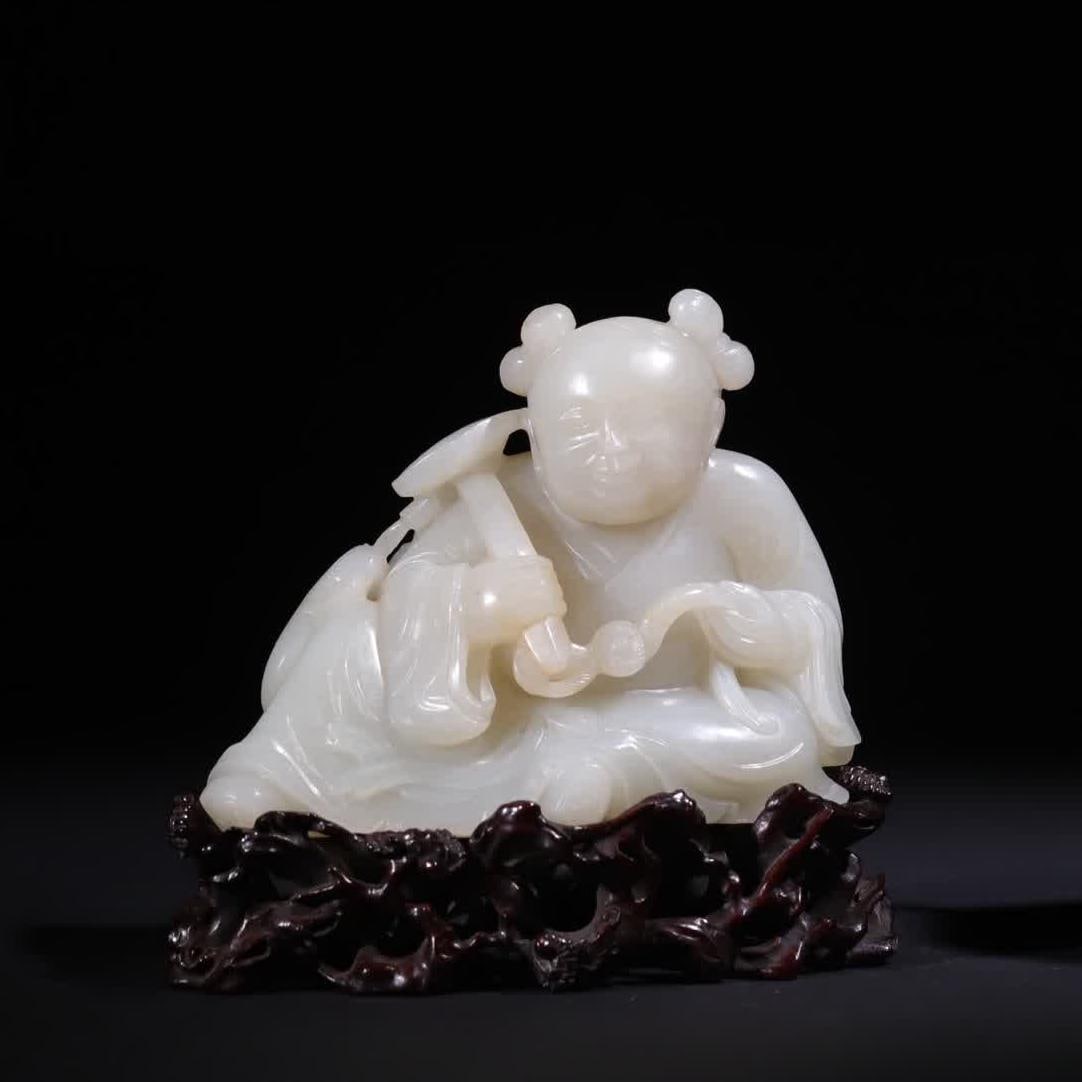 A Qing Dynasty Qing Qianlong Hetian jade boy holding a ruyi play double carp ornament (1 of 13)