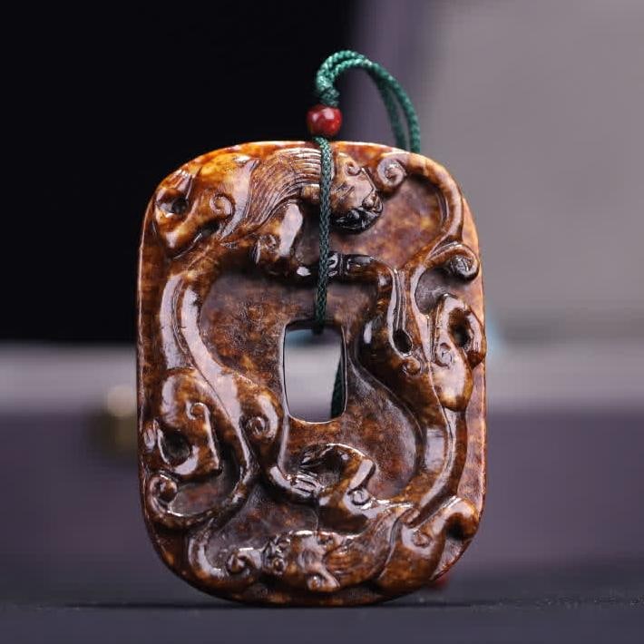 A piece of ancient jade embossed dragon pattern card-shaped jade: The ancient jade relief dragon pattern card shape is irregular in the shape of the card, the middle is set up with a square hole, the jade material is Hetian jade, the texture is thick and the color i