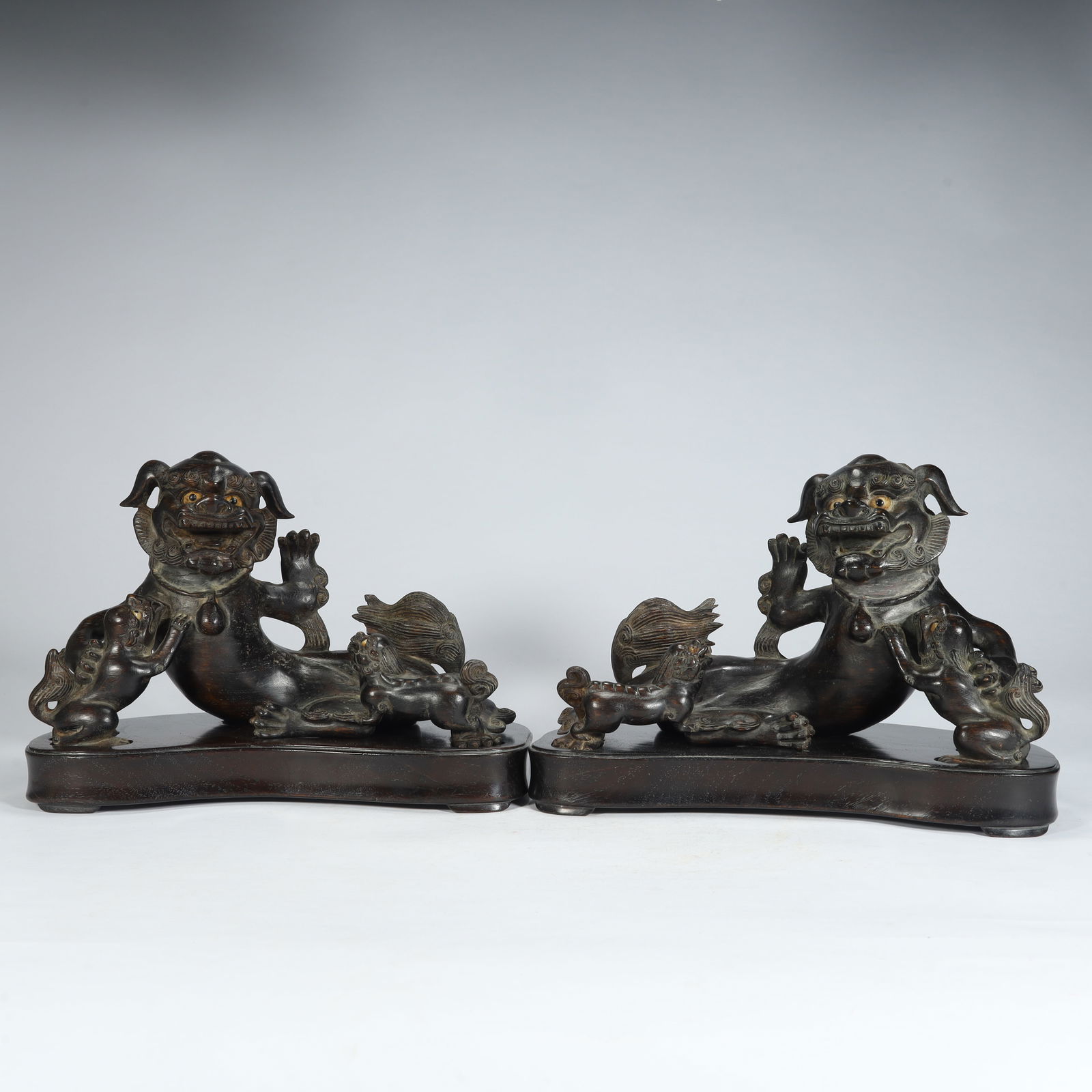 A pair of Qing Dynasty agarwood carvings of Taishi and Young Lion ornaments (1 of 12)