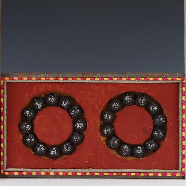 A pair of clear filigree agarwood bracelets (1 of 9)