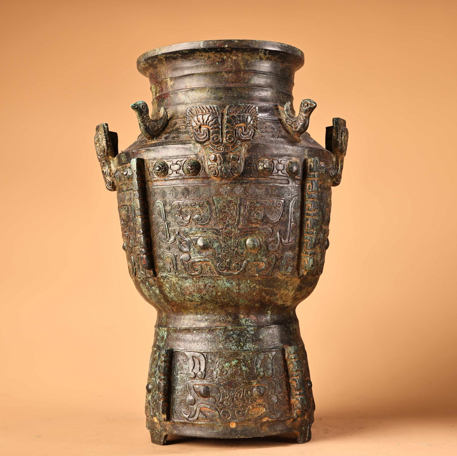 A Shang Dynasty bronze animal face pattern three bird jars (1 of 9)