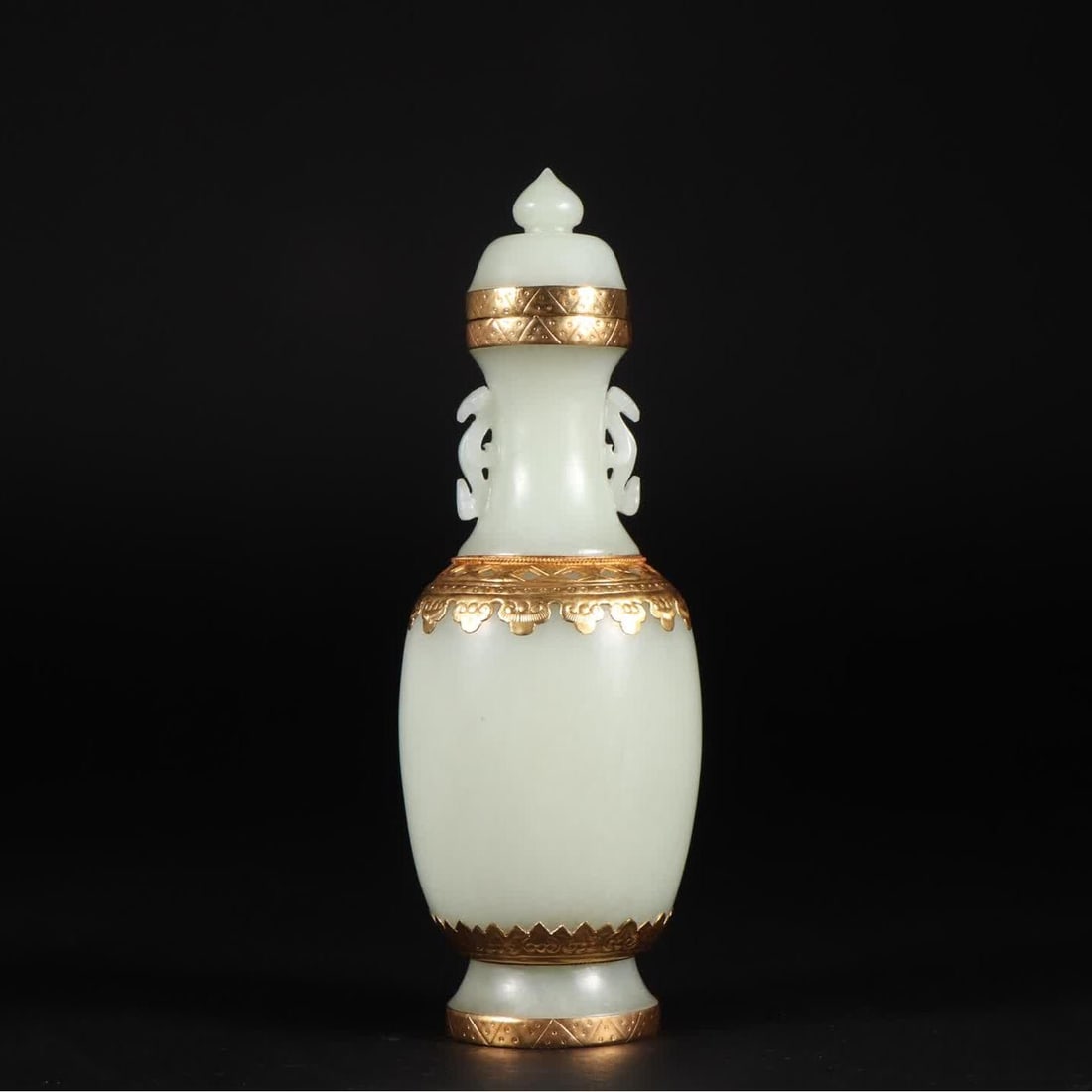 A Qing Dynasty Hetian jade-covered gold-capped bottle (1 of 9)