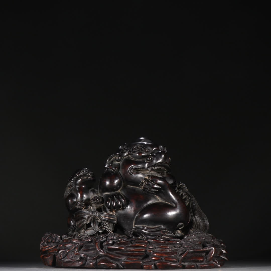 A rosewood mother beast ornament (1 of 9)