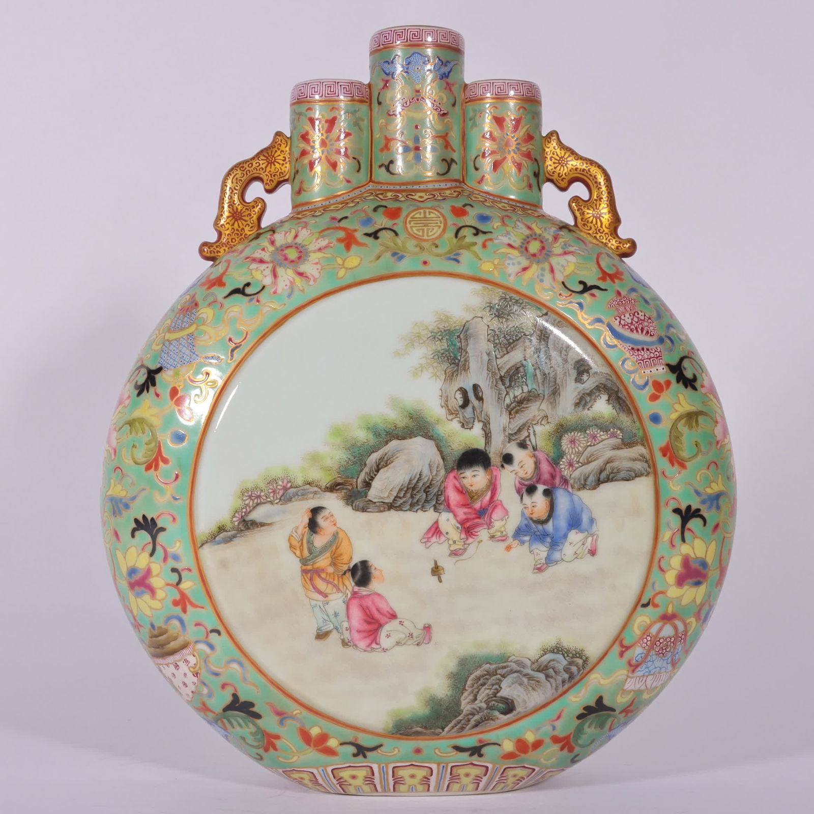 A piece of Qing Qianlong enamel green background painted with gold entwined lotus window baby play: Qing Qianlong enamel green background gold entwined lotus window baby play picture three-tube moon holding bottle SIZE: H: 27.6cm MouthD: 3.2cm Belly diameter 21.5cm Bottom diameter 7cm (The Dimension