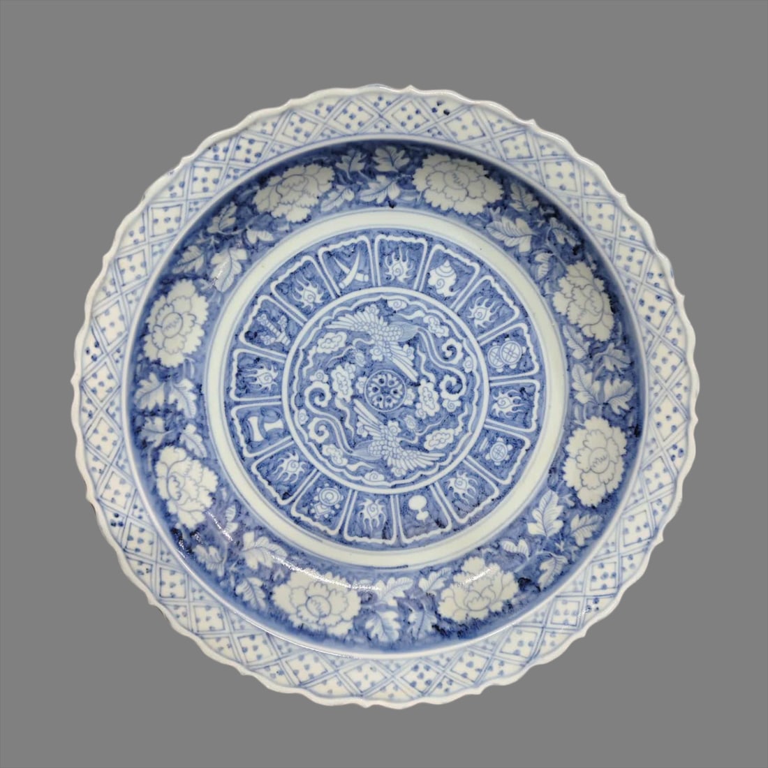 A Ming Dynasty blue and white entwined lotus and phoenix pattern plate (1 of 7)