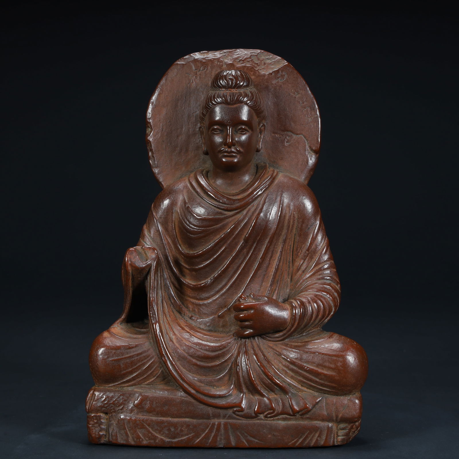 A seated statue of a red clay Buddha in the style of the Qing Dynasty, (1 of 12)