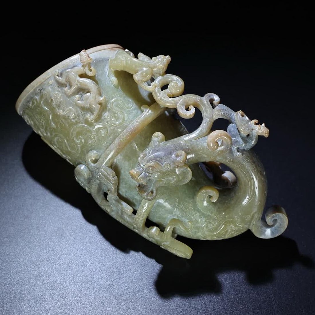 A Han Dynasty jade high relief corner cup (1 of 9)