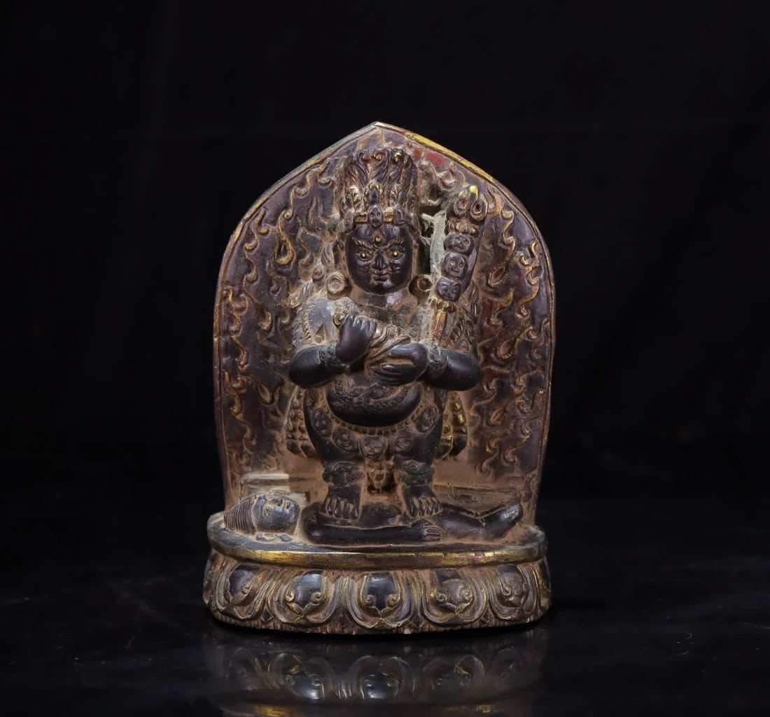 A black stone painted gold-painted Mahakala statue (1 of 9)