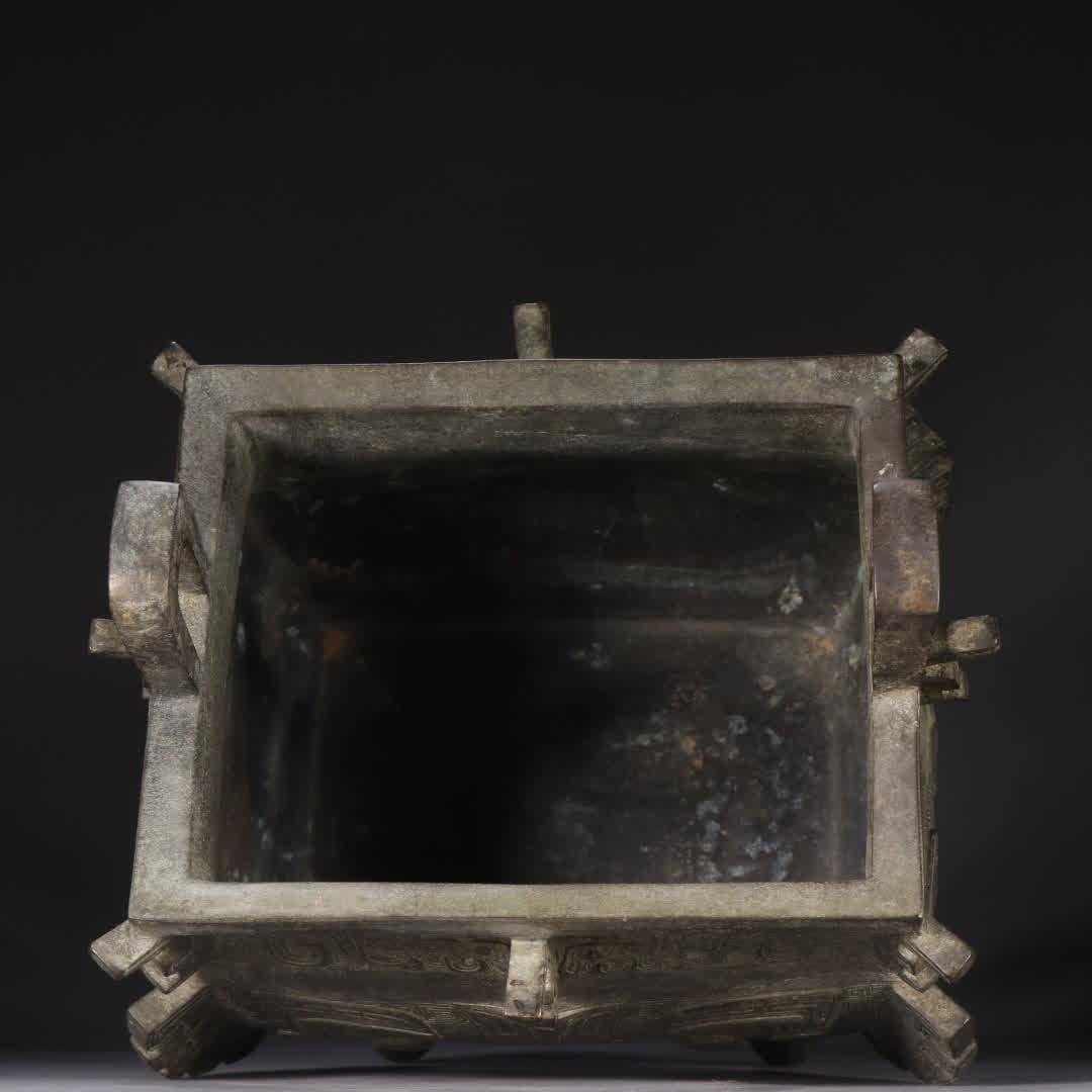 A copper gluttonous pattern square tripod - 8