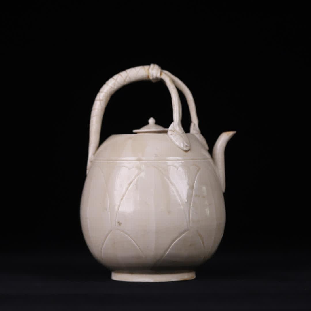 A Song Dynasty Ding kiln white glaze carved liang pot (1 of 9)
