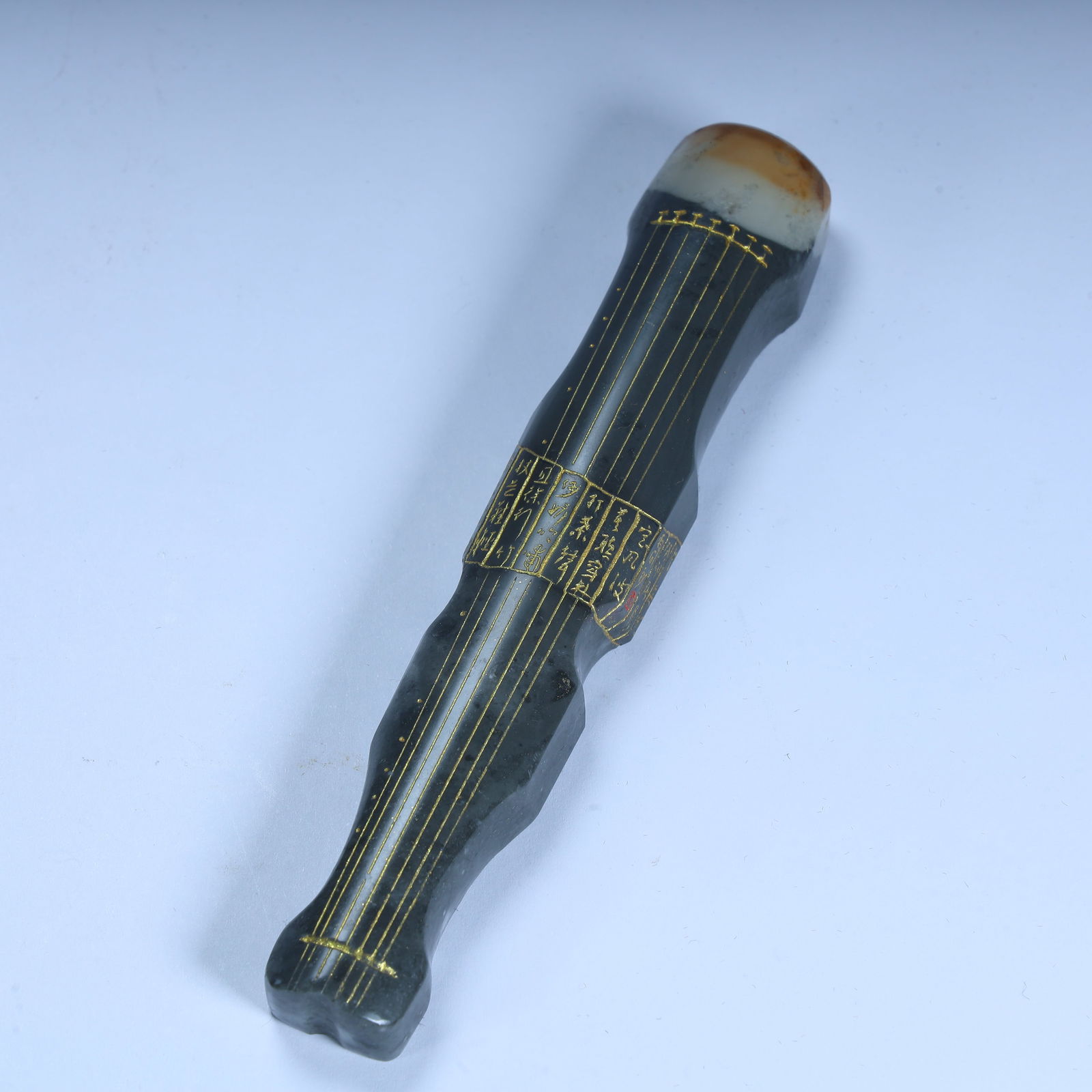 A Qing Dynasty jade guqin-shaped ornament (1 of 11)