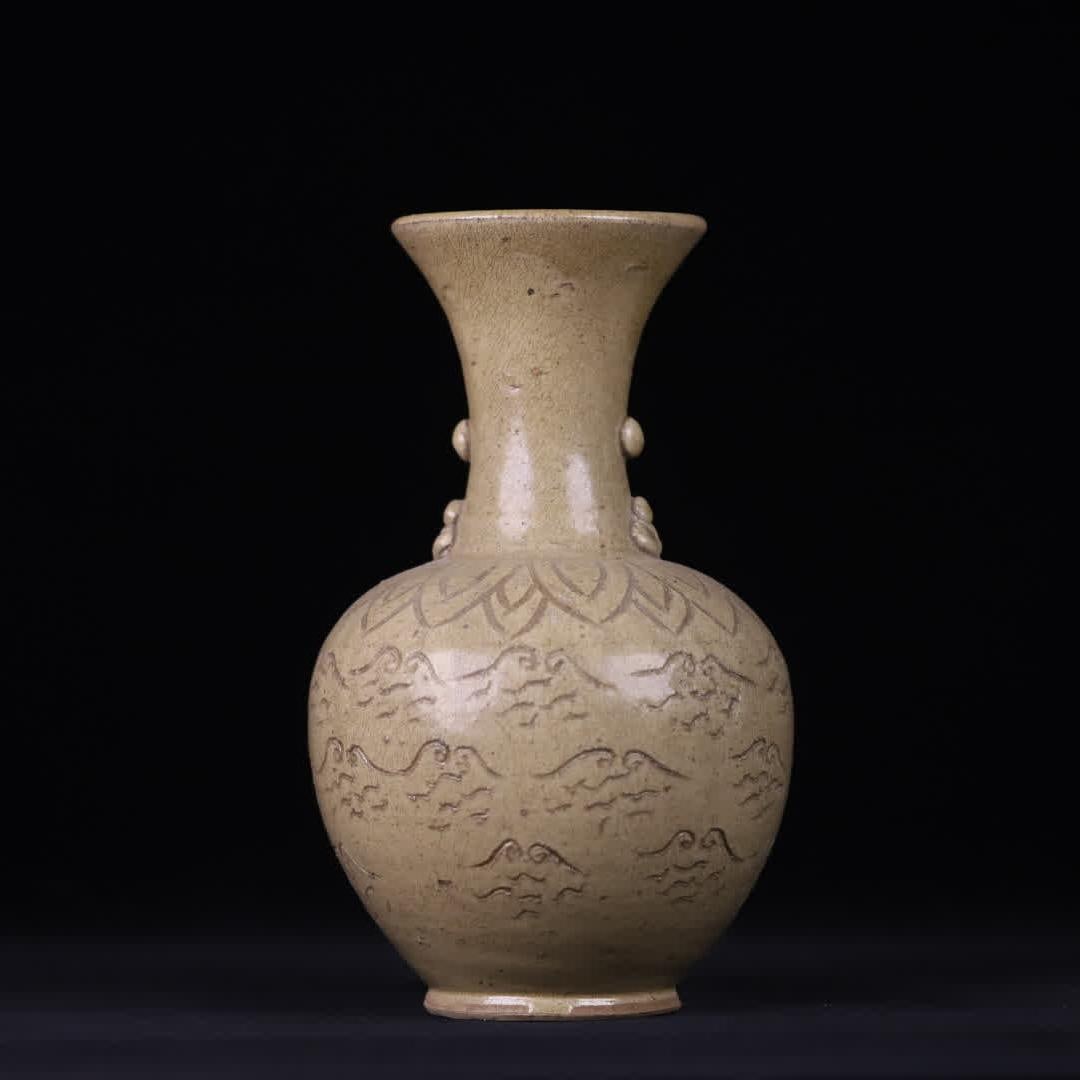 A Song Dynasty celadon carved paste plastic bottle (1 of 9)