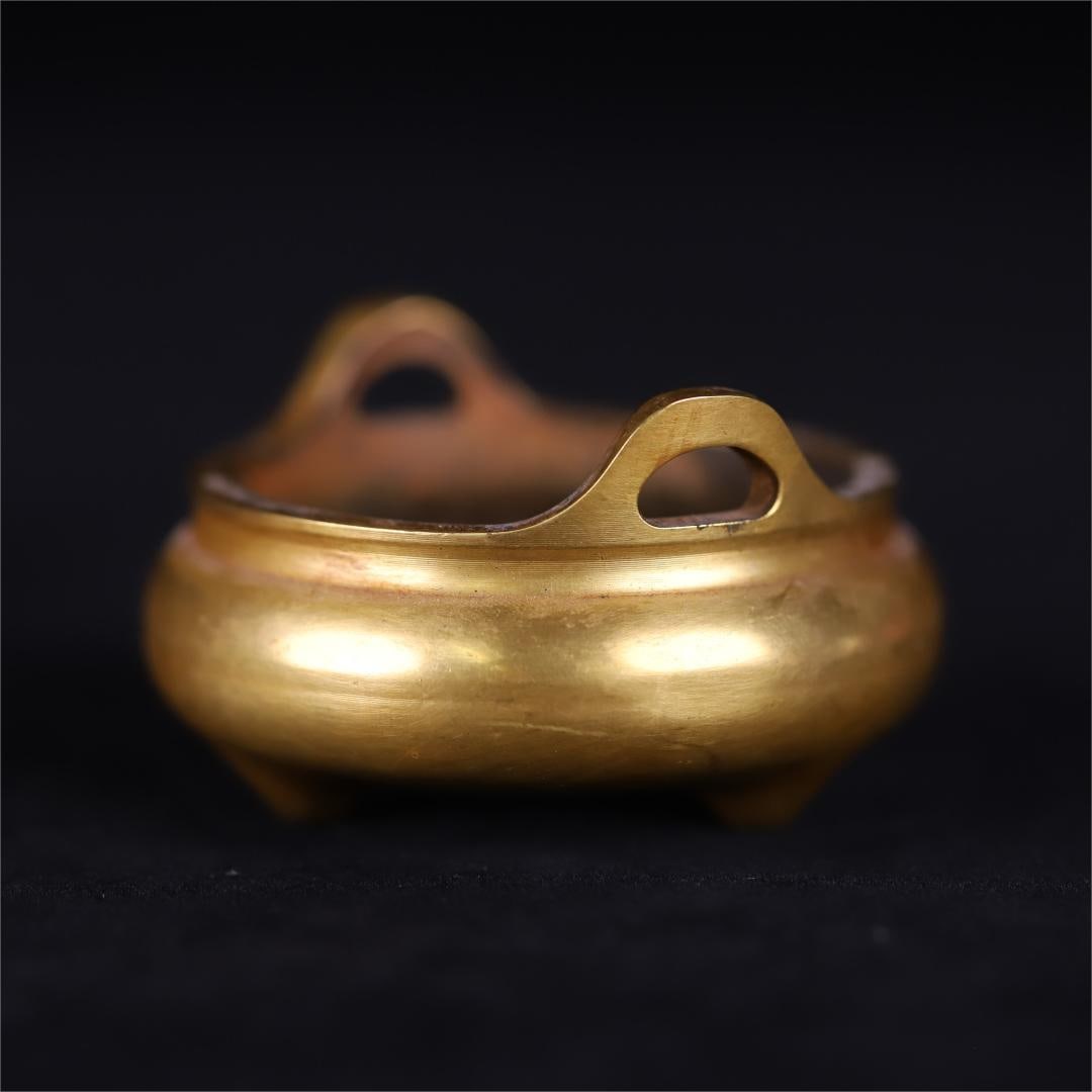 A copper-gilt amphora three-legged furnace from the Qing Dynasty (1 of 9)