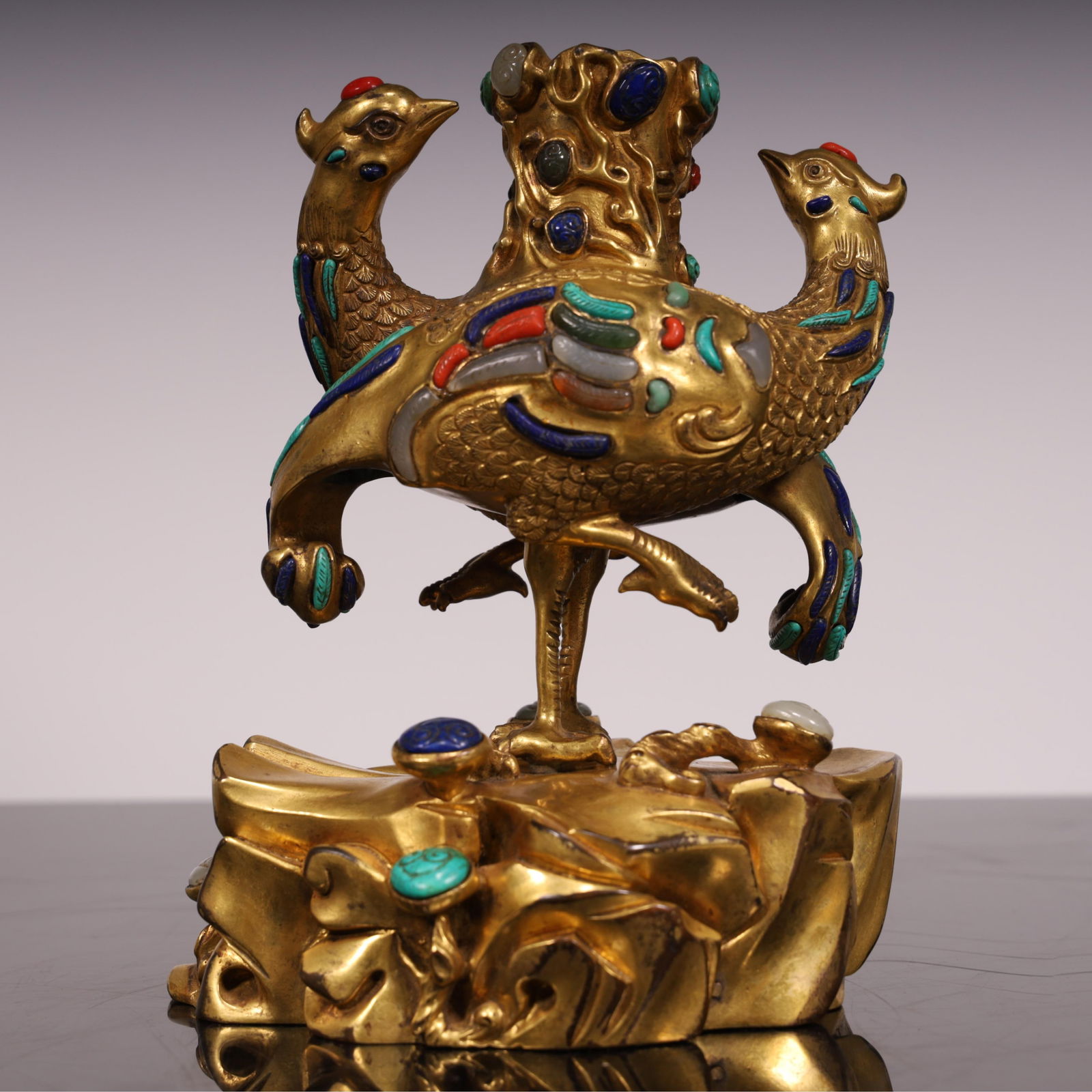 A copper-gilt phoenix candlestick from the Qing Dynasty (1 of 12)