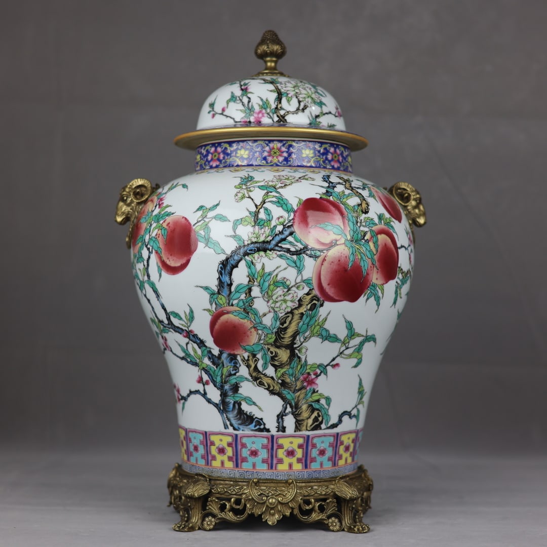A fine copper-inlaid porcelain pastel nine-peach pattern bronze lion's ear general jar (1 of 8)