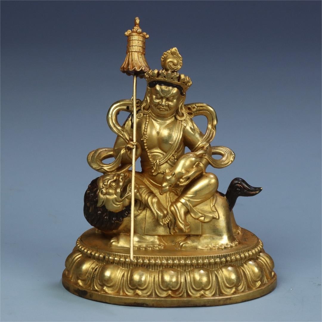 A seated statue of the King of Heavenly Treasure in copper gilt from the Qing Dynasty (1 of 11)