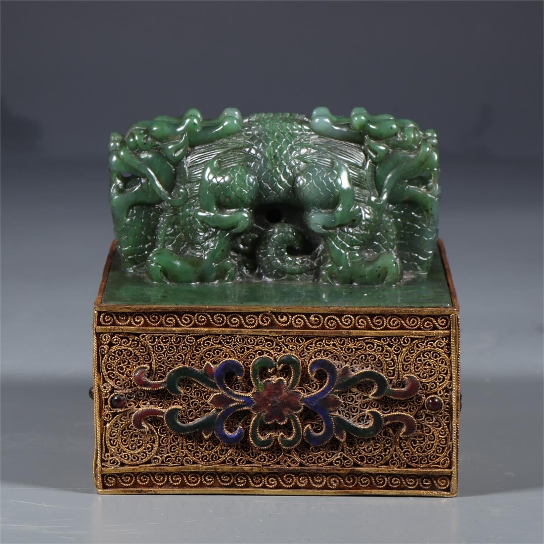 A Qing Dynasty Hetian jasper dragon button wrapped filigree seal: Qing Dynasty Hetian jasper cross-dragon button wrapped filigree seal Size:Square:10.5cm H:10cm W:2029g (The Dimensions Of All Batches Are Manually Measured.If You Need More