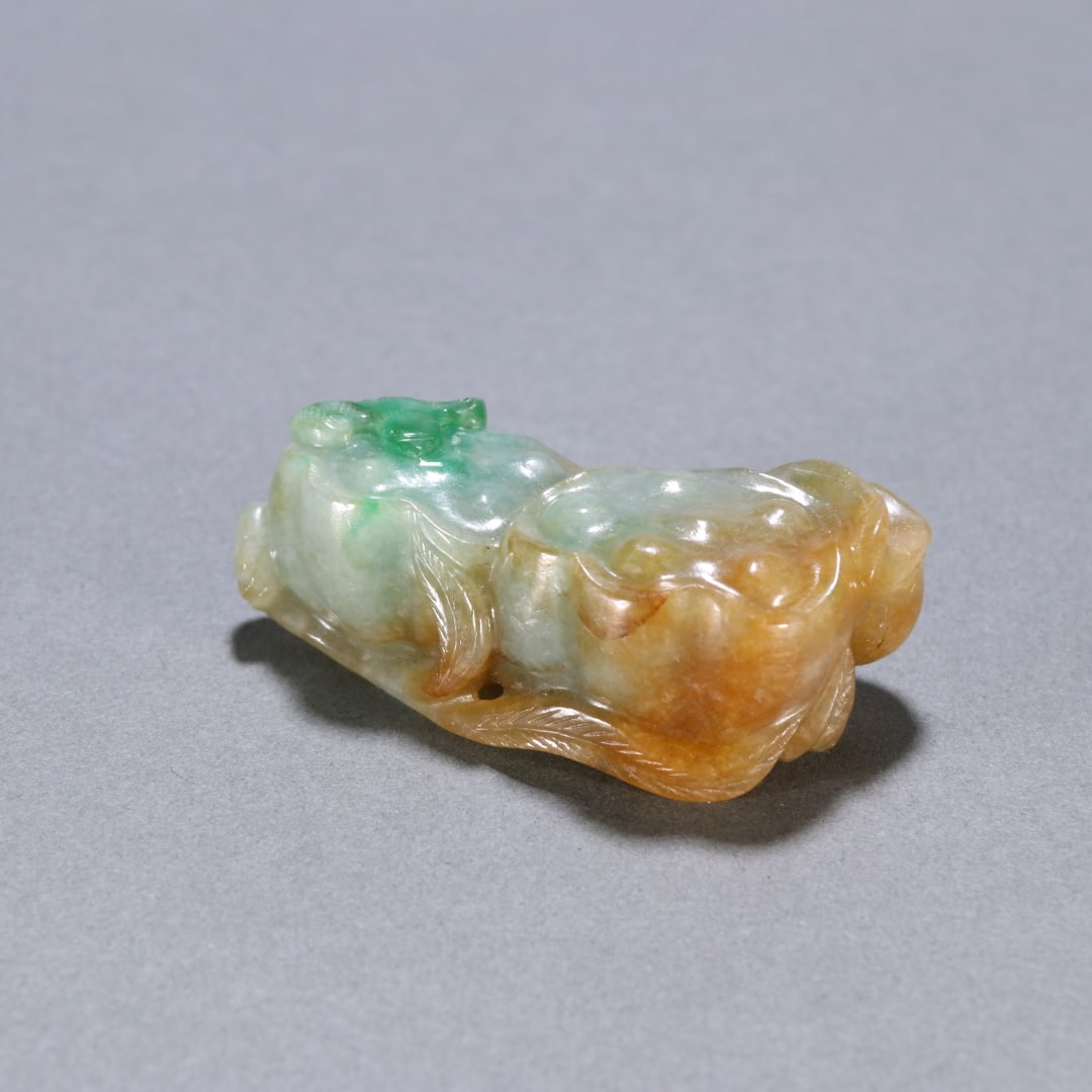A jade lotus pod carving from the Qing Dynasty (1 of 9)