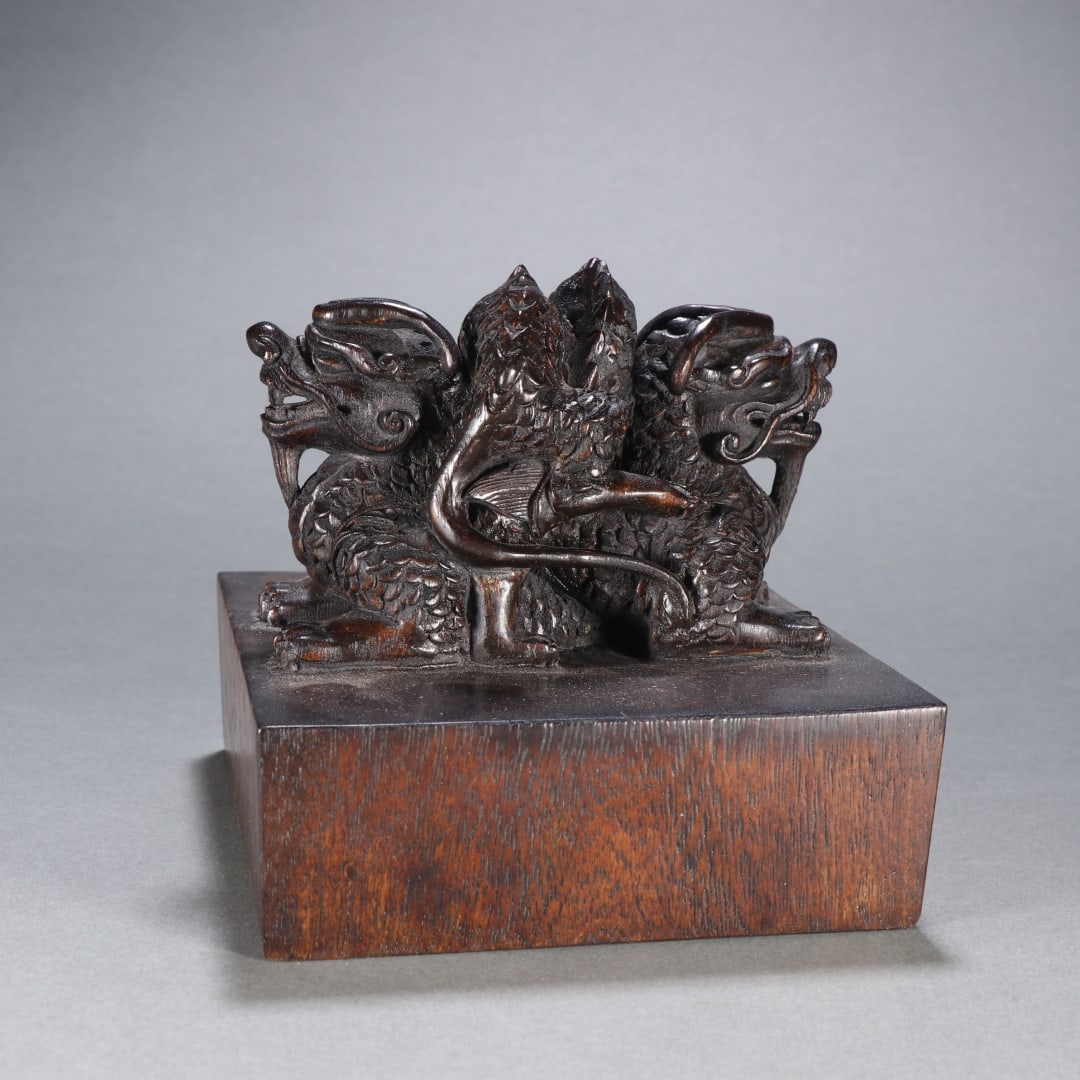 A Qing Dynasty agarwood dragon button seal (1 of 9)