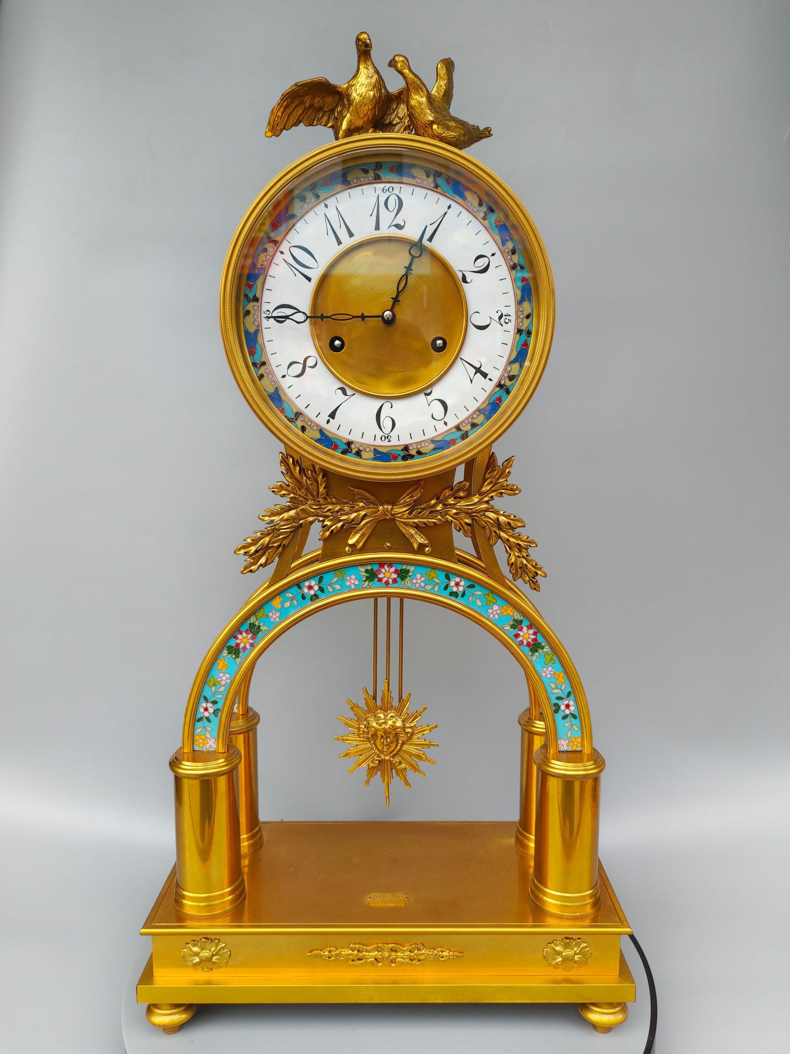 A fine gilt cast copper mechanical table clock (1 of 9)