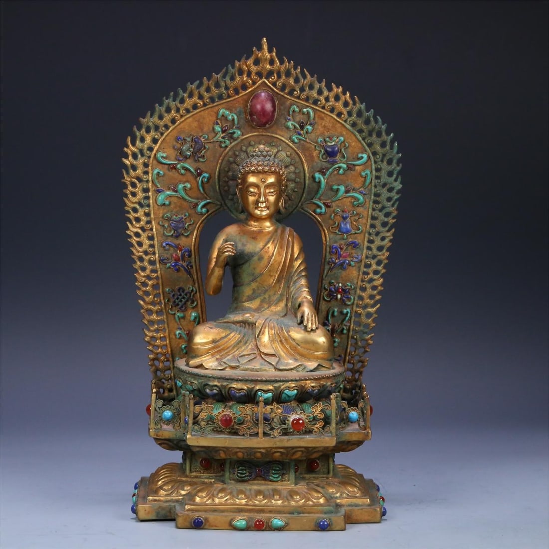 A beautiful bronze gilt inlaid statue of Shakyamuni: Exquisite bronze gilt inlaid with many treasures of Shakyamuni statue Size:29.5x18x15.8cm W:2210g (The Dimensions Of All Batches Are Manually Measured.If You Need More Detailed Information, Please Con