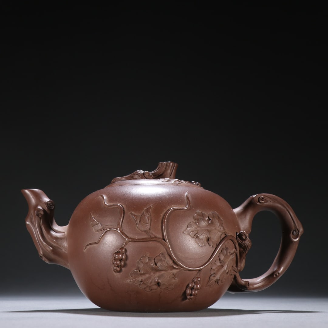 A Zhu Kexin purple sand pile carved squirrel grape teapot: Zhu Kexin's purple sand pile carved squirrel grape teapot Size:H:9cm L:16.8cm (The Dimensions Of All Batches Are Manually Measured.If You Need More Detailed Information, Please Contact Our Customer Se