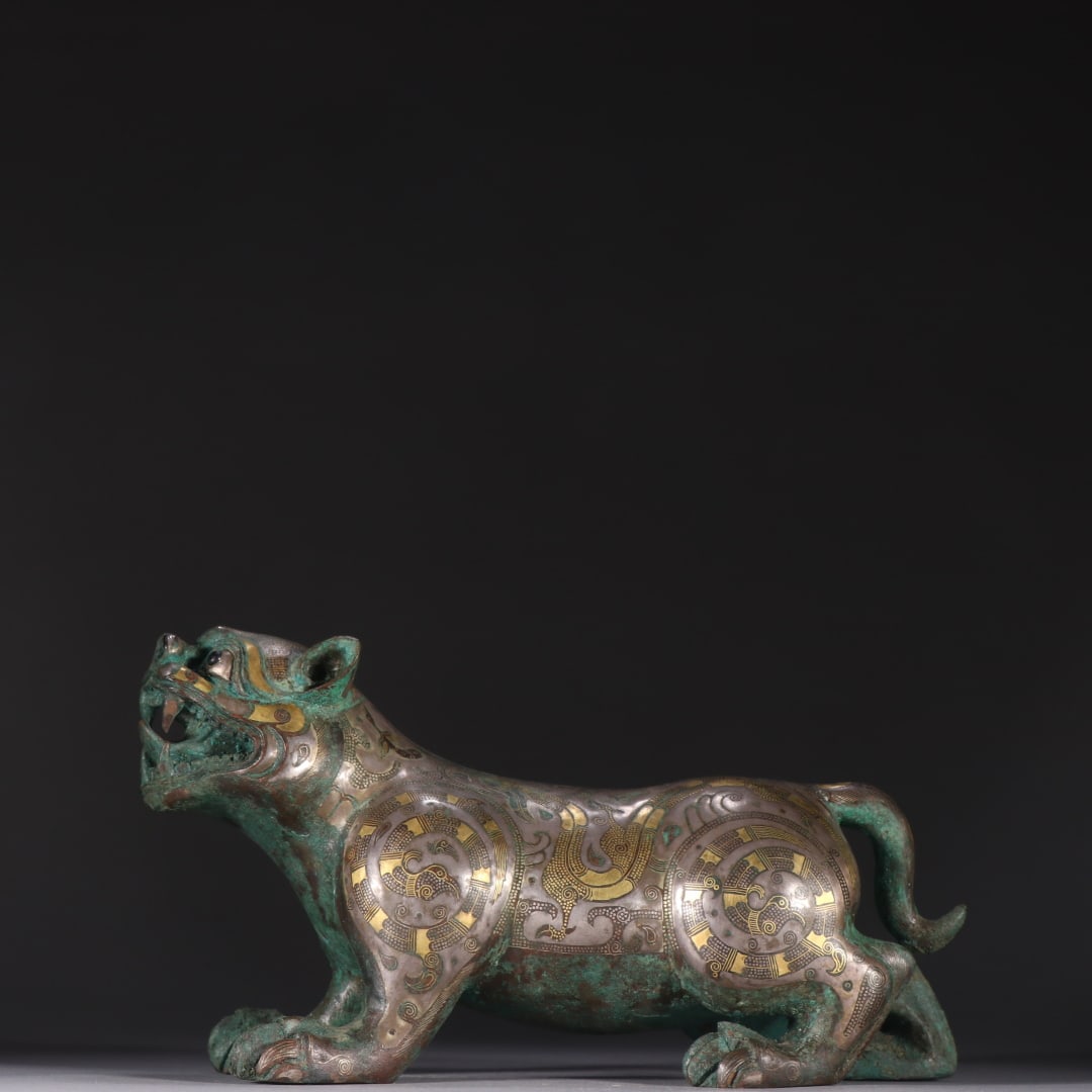 A bronze gold and silver turquoise beast ornament from the Han Dynasty (1 of 9)