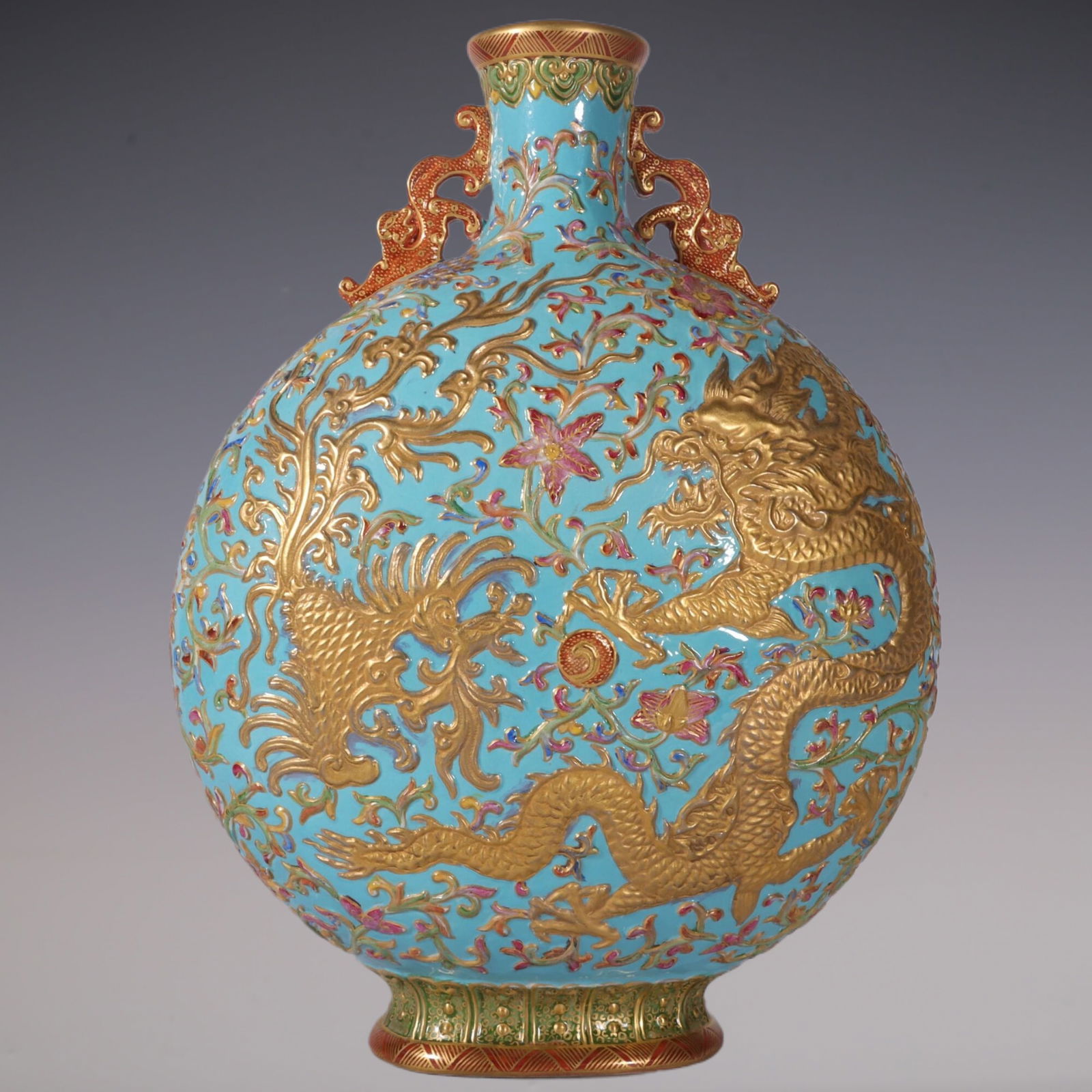 An Exquisite Enamel Green Ground Dragon and Phoenix Pattern Double-Ears Vase: An Exquisite Enamel Green Ground Dragon and Phoenix Pattern Double-Ears Vase Qing Dynasty, China Qianlong Six-character Mark Size:32cmx23cm (The Dimensions Of All Batches Are Manually Measured.If You