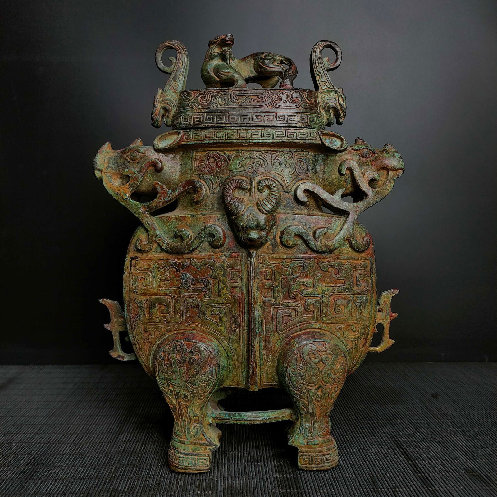 An Exquisite Bronze Beast-Face Pattern Double-Ears and Tripod Vase (1 of 9)