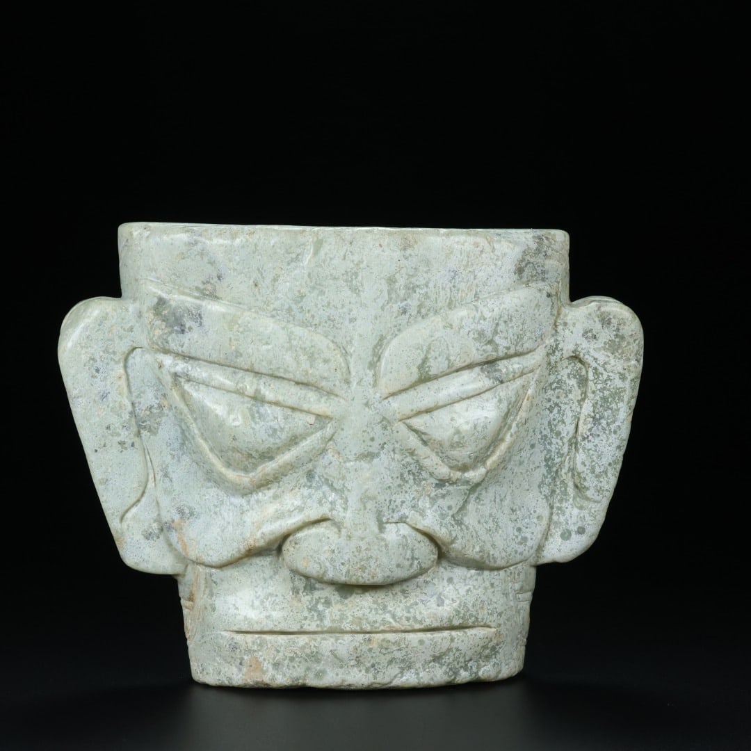 An Exquisite White Jade Mask Ornament (1 of 9)